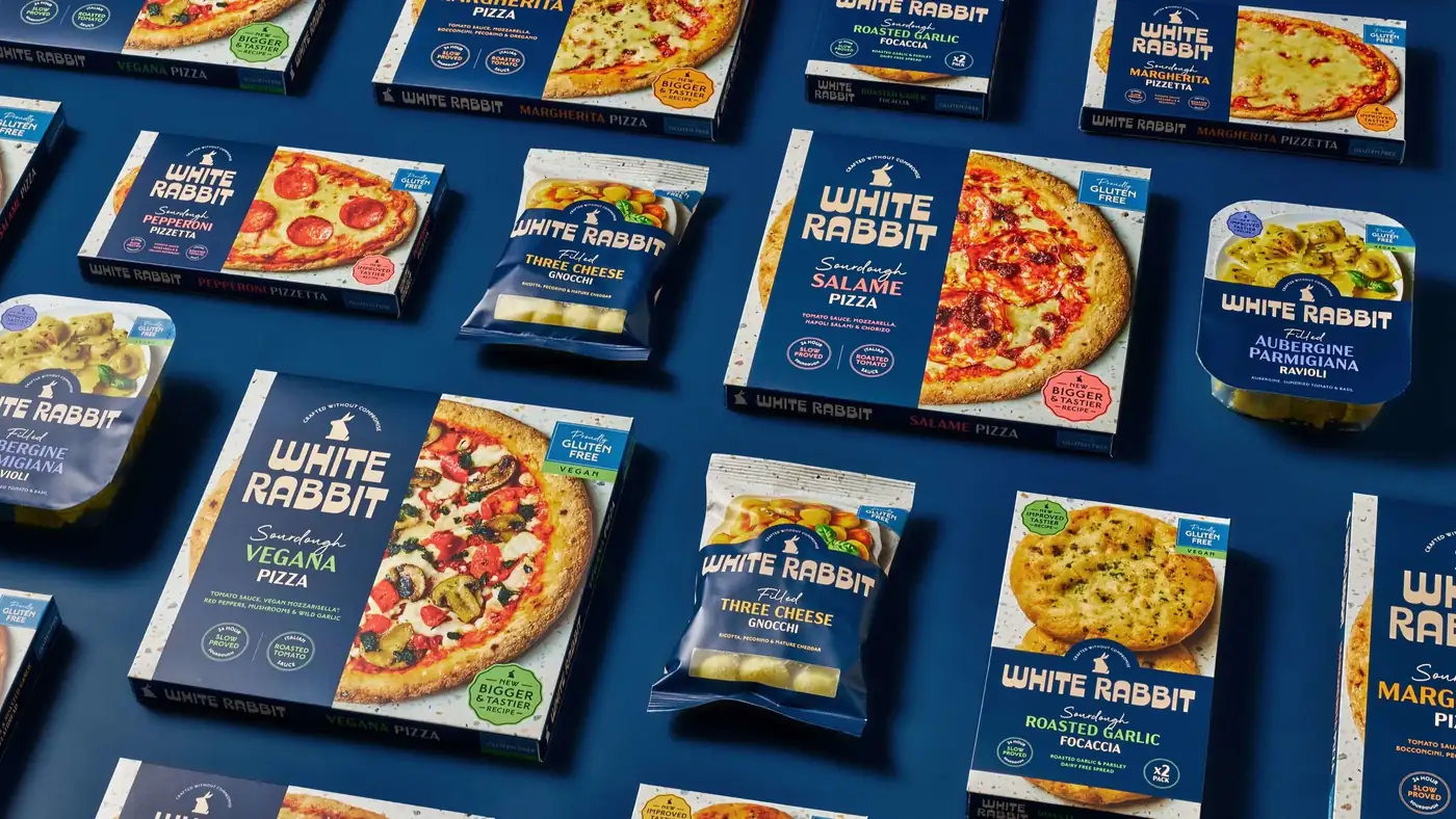 The full White Rabbit range \u2014 pizzas, pizzettas, focaccia, gnocchi and ravioli \u2014 laid out in a grid on blue