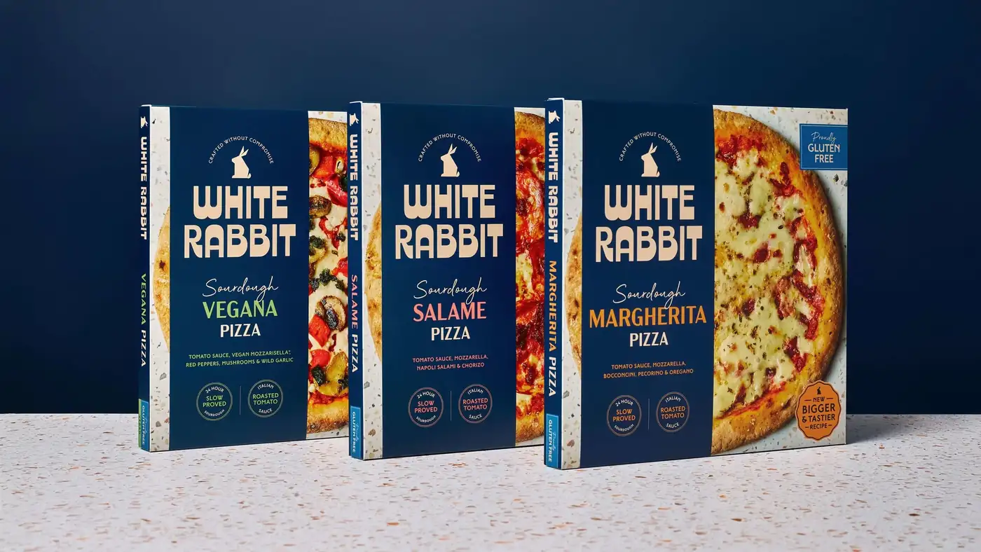 White Rabbit Vegana, Salame and Margherita sourdough pizza boxes on a terrazzo surface