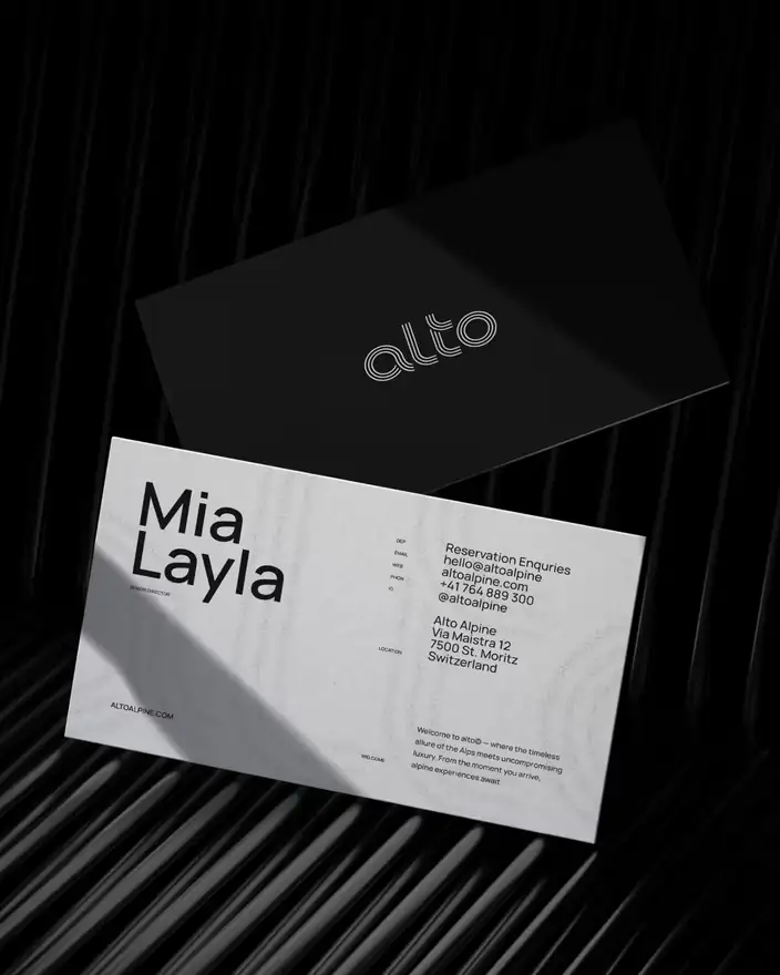 Two Alto business cards, one black with the outlined wordmark and one white with reservation contact details